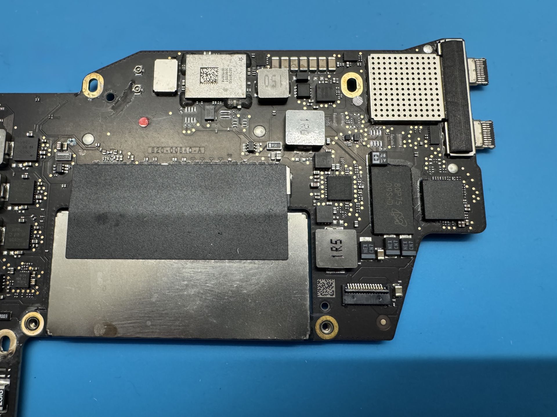 Edge of motherboard from 2017 MacBook removed from body